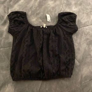 Black express top. Size Large. NWT